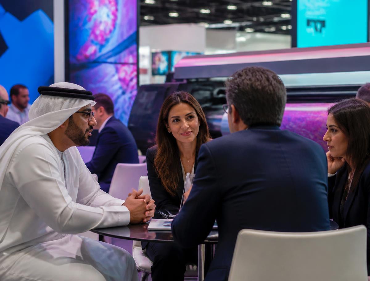 Business leaders meeting at an industry exhibition